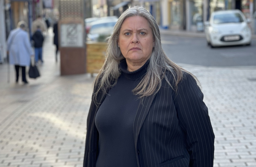 Roz McCall MSP on a high street in Fife at the camera